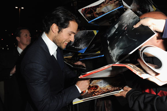 Henry Cavill signs autographs for fans at the Immortals premiere in LA 