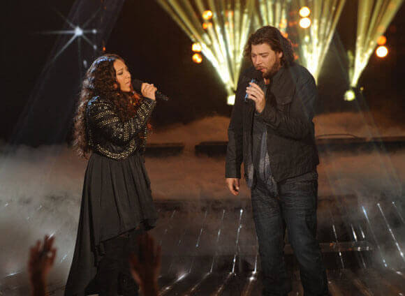 Melanie Amaro (L) and Josh Krajcik (R) perform on The X Factor on Dec. 22, 2011