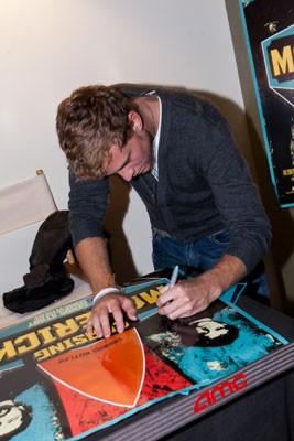 Jonny Weston signs a 'Chasing Mavericks' poster