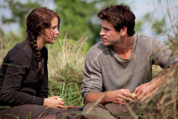 Jennifer Lawrence and Liam Hemsworth in a scene from The Hunger Games.